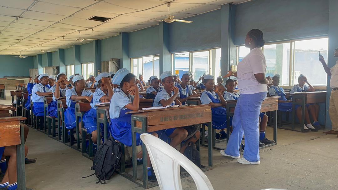 Amen Rachael teaching students in a classroom